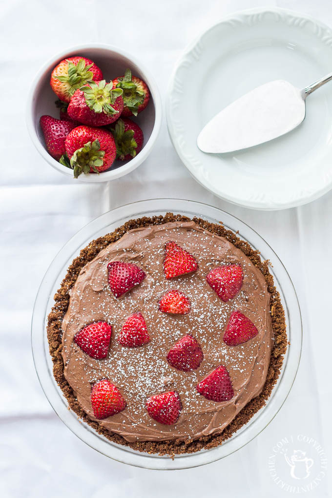 Dark Chocolate Cream Pie with fresh strawberries! This pie recipe is sweet but not too sweet, with deep cocoa flavor - definitely for the true chocolate lover! 