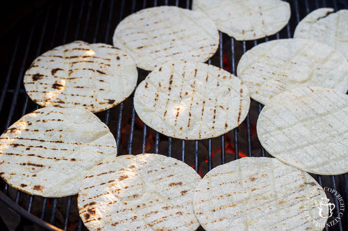 While the grill is still on, throw your white corn tortillas onto the grilling surface for about thirty seconds. Guess what? You're done!