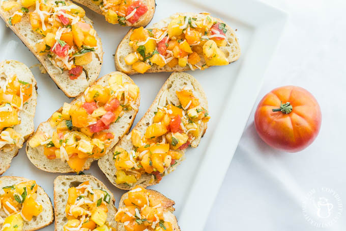 Heirloom Tomato Bruschetta is our favorite, simple go-to recipe for light, healthy summer grilling! This recipe has five ingredients, & is ready in 15 min!