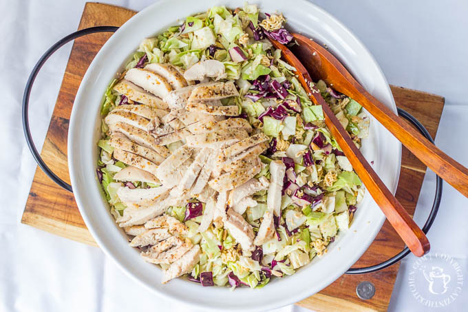 Oriental Chicken Salad is light, yummy, and full of crunch - a perfect summer salad! It's an easy way to feed a crowd - or make sure there will be seconds!