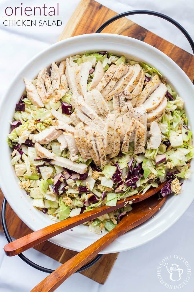Oriental Chicken Salad is light, yummy, and full of crunch - a perfect summer salad! It's an easy way to feed a crowd - or make sure there will be seconds!