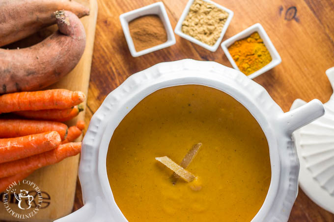 This easy recipe for slow cooker curried sweet potato & carrot soup is spice-forward! Bland soup be gone, this creamy bowl of spiced goodness will delight your tastebuds!