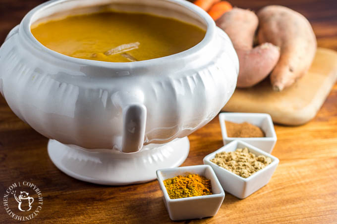 This easy recipe for slow cooker curried sweet potato & carrot soup is spice-forward! Bland soup be gone, this creamy bowl of spiced goodness will delight your tastebuds!