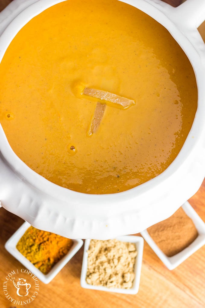 This easy recipe for slow cooker curried sweet potato & carrot soup is spice-forward! Bland soup be gone, this creamy bowl of spiced goodness will delight your tastebuds!