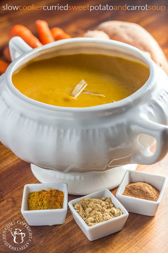 This easy recipe for slow cooker curried sweet potato & carrot soup is spice-forward! Bland soup be gone, this creamy bowl of spiced goodness will delight your tastebuds!
