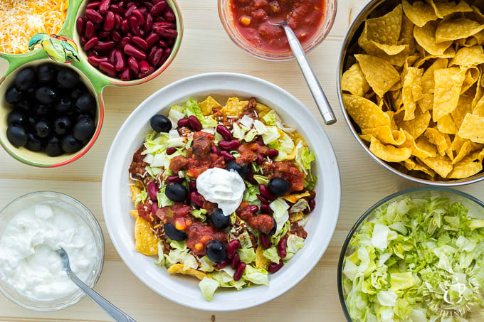 This recipe for "trainwreck" taco salad is simple, inexpensive, easily customizable, and incredibly tasty! It will please your family, or a crowd of almost any size!