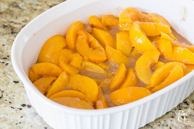 Old Fashioned Peach Cobbler is literally a recipe for comfort! This easy dessert features hints of cinnamon and nutmeg alongside sweet, juicy peaches - yum!