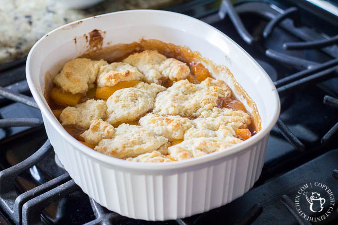 Old Fashioned Peach Cobbler is literally a recipe for comfort! This easy dessert features hints of cinnamon and nutmeg alongside sweet, juicy peaches - yum!