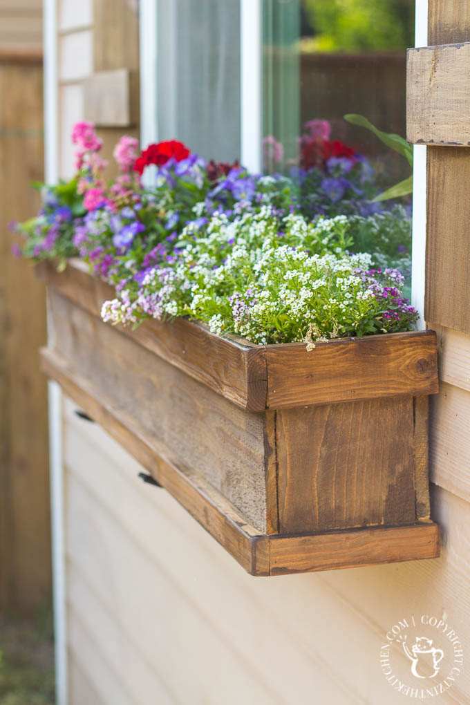 Looking to dress up a plain exterior window? It doesn't get any cheaper, easier, or more flexible than this plan for a DIY Window Box and Shutters!