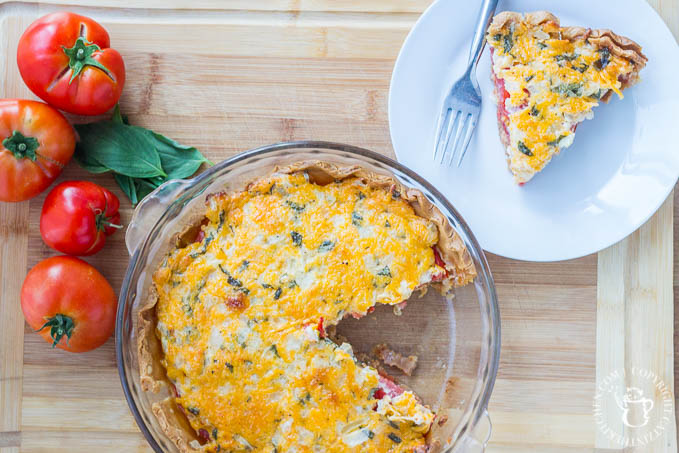 Fresh, a little rustic, and oh-so-tasty, this Tomato Basil Pie recipe is just the dish to showcase those tomatoes bursting out of your garden this fall!