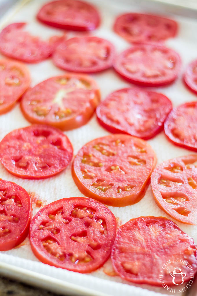 Fresh, a little rustic, and oh-so-tasty, this Tomato Basil Pie recipe is just the dish to showcase those tomatoes bursting out of your garden this fall!