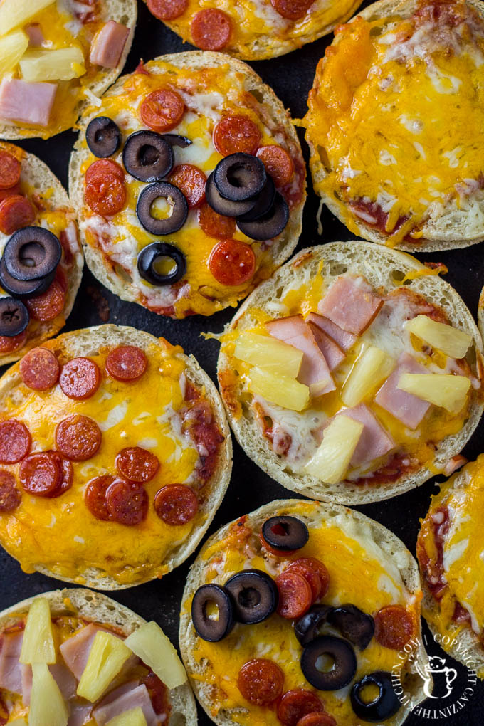 These fun, easy, quick English muffin pizzas are a family favorite - we make them all the time! The kids love designing their own mini pizza masterpieces!