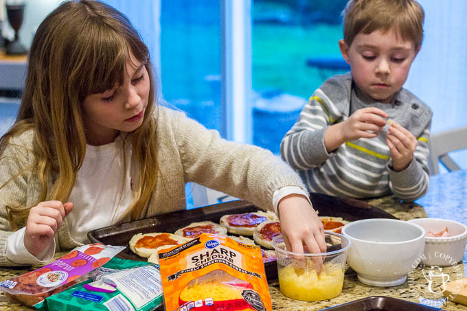 These fun, easy, quick English muffin pizzas are a family favorite - we make them all the time! The kids love designing their own mini pizza masterpieces!