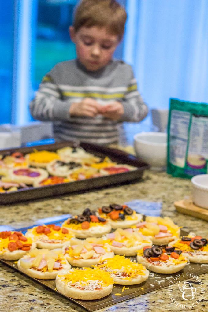These fun, easy, quick English muffin pizzas are a family favorite - we make them all the time! The kids love designing their own mini pizza masterpieces!