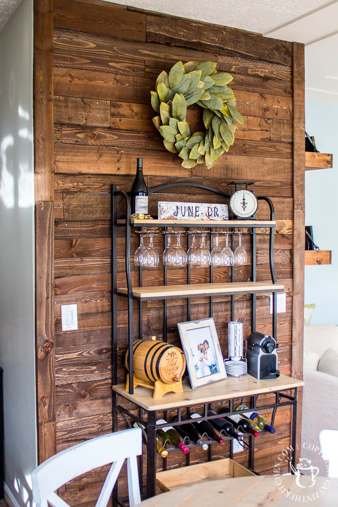 A DIY Pallet Wall is an inexpensive, homey way to add a big dose of character to almost any room! Here are some things we learned doing ours!