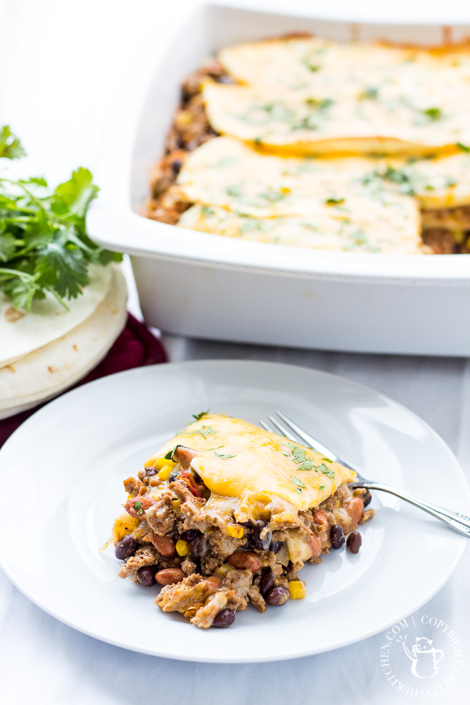 This delicious family favorite Mexican Lasagna recipe is made mostly from ingredients we always have in the pantry and it comes together in just 30 minutes! 
