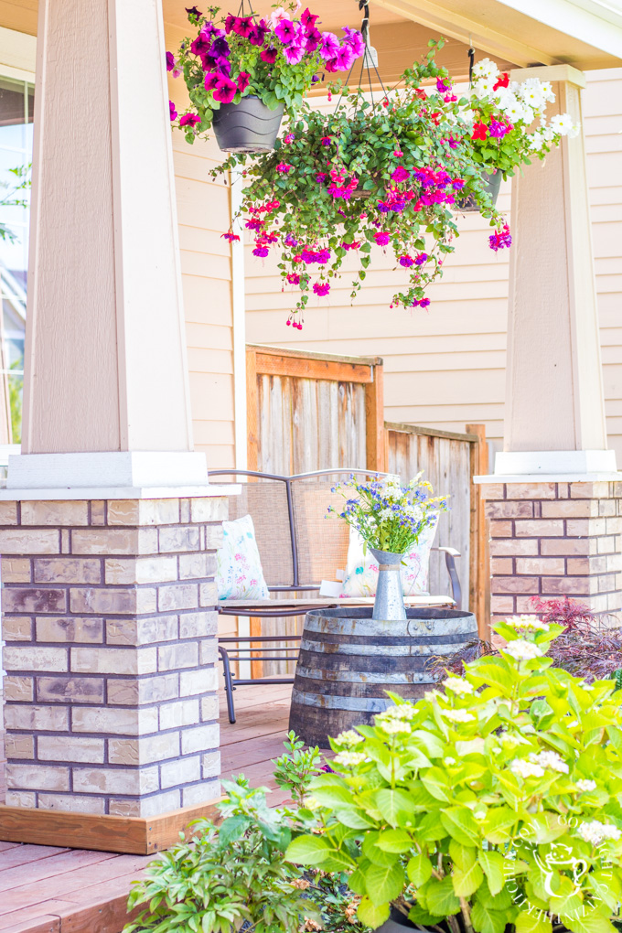 If you've ever thought about turning your cement porch into a wood deck, it's surprisingly easy! Here are some thoughts, tips, & photos from our experience!