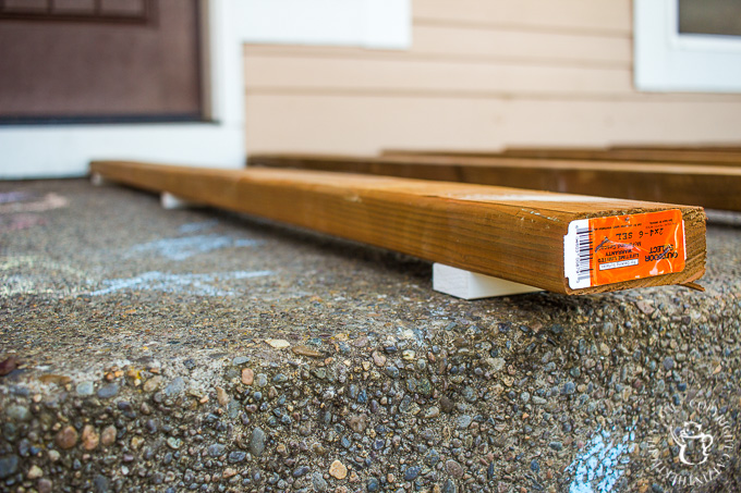 If you've ever thought about turning your cement porch into a wood deck, it's surprisingly easy! Here are some thoughts, tips, & photos from our experience!