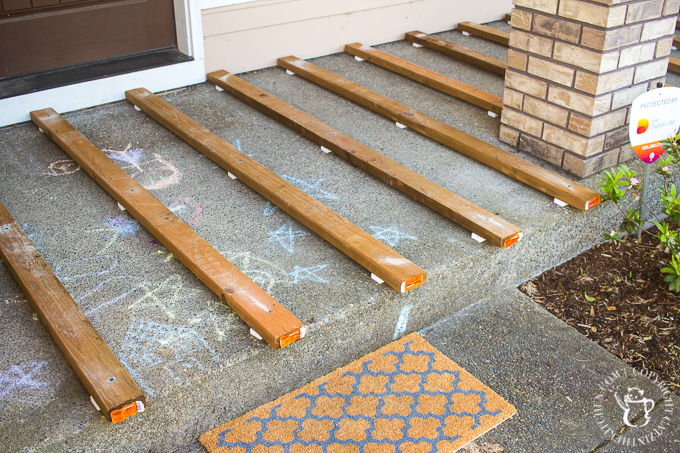 If you've ever thought about turning your cement porch into a wood deck, it's surprisingly easy! Here are some thoughts, tips, & photos from our experience!