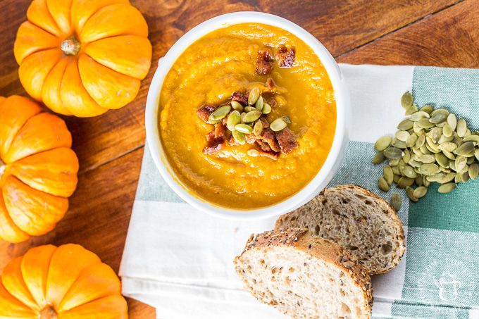 This recipe for pumpkin soup made in the slow cooker is easy, zesty, and bursting with the taste of autumn! Prep in the morning & have an effortless dinner! #pumpkin