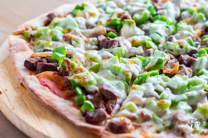 Love the classic combo of steak, cheese, and fried onions? Turn that sandwich craving into pie form with this easy and quick Philly Cheesesteak Pizza! 