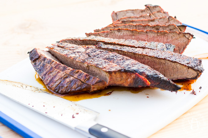 These steak street tacos are super tasty and incredibly easy to make! An inexpensive cut of steak works great, grilled alongside corn tortillas, with a fresh cabbage and salsa topping!