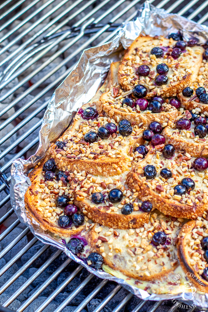 Made on the grill or the campfire, this Grilled Blueberry French Toast is smoky & decadent, but still fresh and sweet, thanks to the blueberries and syrup!