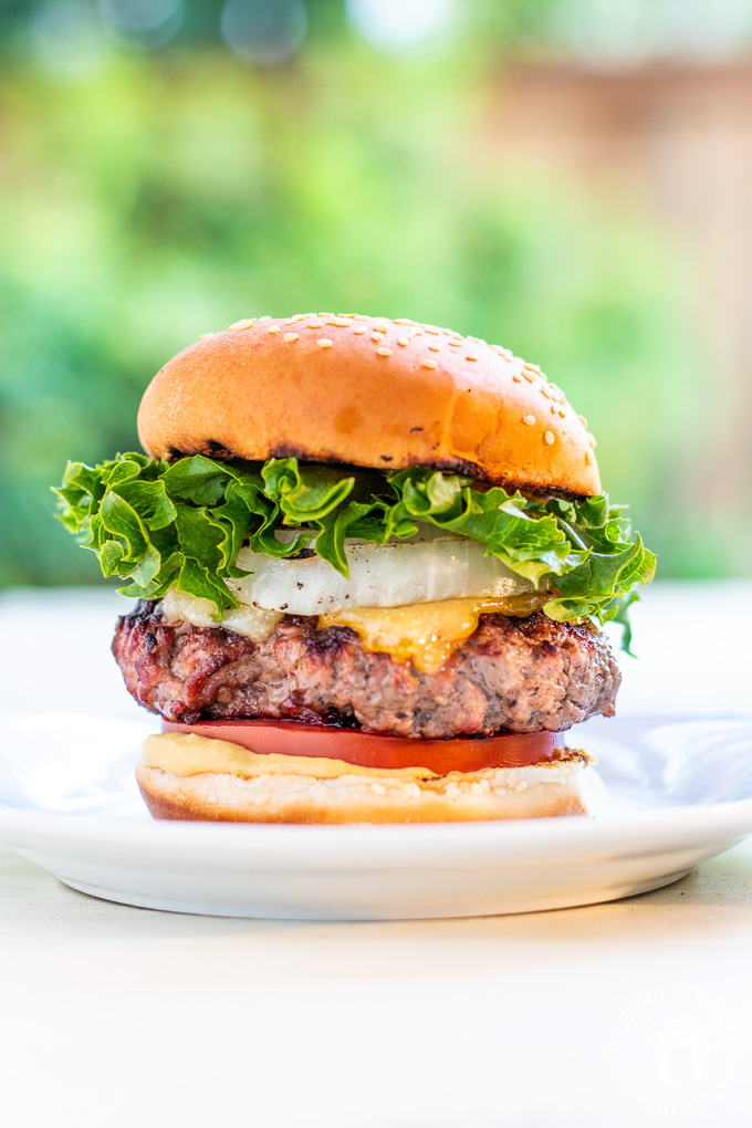 Bobby Flay put his spin on an otherwise traditional burger by adding grilled onions, horseradish mustard, and two cheeses - the double cheddar burger!