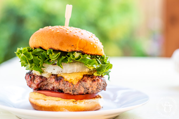 Bobby Flay put his spin on an otherwise traditional burger by adding grilled onions, horseradish mustard, and two cheeses - the double cheddar burger!